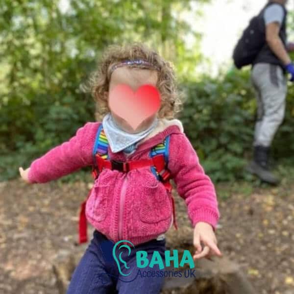 girl wearing a baha headband