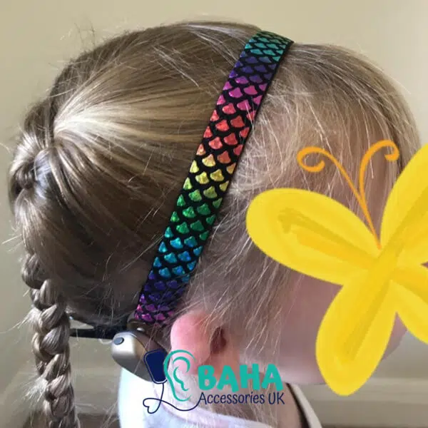 girl wearing a metallic baha headband